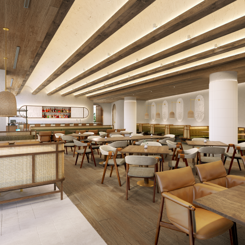 A modern restaurant interior with wooden tables, cushioned chairs, ceiling lights, and a bar area in the background.